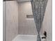 A bathtub and shower featuring decorative tile work and a curtain at 346 Horseshoe Rd, Moncks Corner, SC 29461