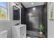 Sleek bathroom featuring a tiled shower, modern vanity, and a decorative plant at 346 Horseshoe Rd, Moncks Corner, SC 29461