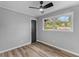 Bedroom featuring natural lighting, a dark interior door, and a ceiling fan at 346 Horseshoe Rd, Moncks Corner, SC 29461