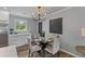 Inviting dining area with a chandelier, a round glass table, and comfortable chairs at 346 Horseshoe Rd, Moncks Corner, SC 29461