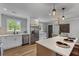 Bright kitchen featuring white cabinets, stainless steel appliances, and a stylish kitchen island at 346 Horseshoe Rd, Moncks Corner, SC 29461