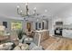 Bright kitchen featuring a kitchen island, stainless steel appliances, and a dining area at 346 Horseshoe Rd, Moncks Corner, SC 29461