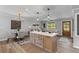Open-concept living room featuring modern lighting, a dining area, and a kitchen island at 346 Horseshoe Rd, Moncks Corner, SC 29461