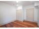 Bedroom with hardwood floors, closet, and natural light streaming through a window at 35 Society # H, Charleston, SC 29401