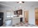 Bright kitchen with white countertops, tile floors, stainless appliances, and dark cabinetry at 35 Society # H, Charleston, SC 29401