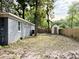 Expansive backyard featuring a storage shed and wooden fence, offering ample space for outdoor activities at 354 Deloach Ave, Walterboro, SC 29488