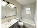 Updated bathroom with tile surround, modern vanity, and shower-tub combo at 354 Deloach Ave, Walterboro, SC 29488