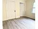 Well-lit bedroom featuring neutral walls, and wood floors at 354 Deloach Ave, Walterboro, SC 29488