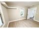 Bright bedroom featuring a window, wood floors, and white trim at 354 Deloach Ave, Walterboro, SC 29488