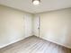 Bedroom featuring neutral walls, modern lighting, and wood-look flooring at 354 Deloach Ave, Walterboro, SC 29488