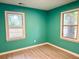 Bright bedroom featuring fresh paint, updated flooring, and natural light from two windows, creating a serene retreat at 354 Deloach Ave, Walterboro, SC 29488