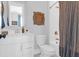 Bathroom features a white vanity, toilet, and shower with decorative decor at 3587 Goodwater St, Mount Pleasant, SC 29466
