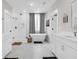 Elegant bathroom featuring dual vanities, soaking tub, and walk-in shower at 3587 Goodwater St, Mount Pleasant, SC 29466