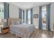 Bedroom with three large windows, wood floors, and blue accents at 3587 Goodwater St, Mount Pleasant, SC 29466