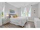 Well-lit bedroom with light color palette featuring a bed, and bright windows at 3587 Goodwater St, Mount Pleasant, SC 29466