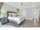 Bedroom with bedside table, hardwood floors, and natural lighting at 3587 Goodwater St, Mount Pleasant, SC 29466