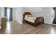 Comfortable bedroom with a stylish wooden bed frame and bright natural light at 3587 Goodwater St, Mount Pleasant, SC 29466