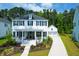 Beautiful two-story home with a landscaped front yard and a driveway leading to a detached garage at 3587 Goodwater St, Mount Pleasant, SC 29466