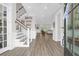 Spacious foyer with hardwood floors, staircase, and a view into the living area at 3587 Goodwater St, Mount Pleasant, SC 29466