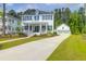 Inviting two-story home featuring a welcoming front porch, classic design, and manicured landscaping at 3587 Goodwater St, Mount Pleasant, SC 29466