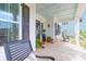 Inviting front porch with rocking chairs, decorative plants, and a ceiling painted haint blue at 3587 Goodwater St, Mount Pleasant, SC 29466