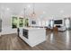 Bright open floor plan connecting a modern island kitchen to a spacious living room at 3587 Goodwater St, Mount Pleasant, SC 29466