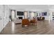 Open-concept living room with a fireplace, large screen tv and seamless access to the dining area at 3587 Goodwater St, Mount Pleasant, SC 29466