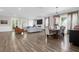 Spacious living room seamlessly connects to the dining area, and features access to the porch and backyard at 3587 Goodwater St, Mount Pleasant, SC 29466