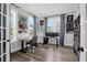 Well-lit office with modern desk, shelving, and large windows offering a pleasant workspace at 3587 Goodwater St, Mount Pleasant, SC 29466