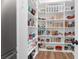 Large walk-in pantry with custom shelving and plenty of storage space for all your groceries at 3587 Goodwater St, Mount Pleasant, SC 29466
