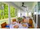 Covered porch with outdoor dining area and a great backyard view at 3587 Goodwater St, Mount Pleasant, SC 29466
