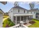 Beautiful two-story home exterior with a screened porch and well-maintained garden at 3587 Goodwater St, Mount Pleasant, SC 29466