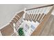 Staircase with wood treads and white risers, leading to lower level at 3587 Goodwater St, Mount Pleasant, SC 29466