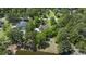 Aerial view of a home near a pond, surrounded by lush greenery and a tranquil neighborhood setting at 3756 Colonel Vanderhorst Circle, Mount Pleasant, SC 29466