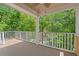 Covered balcony with views of mature trees at 3756 Colonel Vanderhorst Circle, Mount Pleasant, SC 29466