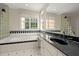 Bathroom with a large tub, tiled accents, and a modern glass block wall at 3756 Colonel Vanderhorst Circle, Mount Pleasant, SC 29466