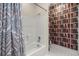 Bathroom featuring a tub and shower and playful wallpaper at 3756 Colonel Vanderhorst Circle, Mount Pleasant, SC 29466