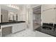 Bathroom with black countertops, white cabinets, tile flooring, and a glass-enclosed shower at 3756 Colonel Vanderhorst Circle, Mount Pleasant, SC 29466