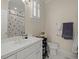 Clean bathroom features a white vanity, tiled floors, and shower with patterned accent tiles at 3756 Colonel Vanderhorst Circle, Mount Pleasant, SC 29466