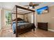 Bedroom featuring a wooden canopy bed, ceiling fan, and a wall-mounted TV for entertainment at 3756 Colonel Vanderhorst Circle, Mount Pleasant, SC 29466