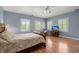 Bedroom with wood floors, a ceiling fan, and a desk under a window at 3756 Colonel Vanderhorst Circle, Mount Pleasant, SC 29466