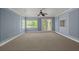 Spacious bonus room with large windows, French doors, and carpet flooring at 3756 Colonel Vanderhorst Circle, Mount Pleasant, SC 29466