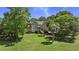 Beautifully landscaped property showcasing a well-maintained lawn, mature trees, and a charming home at 3756 Colonel Vanderhorst Circle, Mount Pleasant, SC 29466