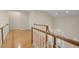 Hallway with hardwood floors, wooden banister, and a clear view down to the front door at 3756 Colonel Vanderhorst Circle, Mount Pleasant, SC 29466