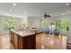 Open kitchen and living space with hardwood floors and stainless appliances at 3756 Colonel Vanderhorst Circle, Mount Pleasant, SC 29466
