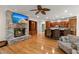 Spacious living room with fireplace, TV, hardwood floors, and opens to the kitchen at 3756 Colonel Vanderhorst Circle, Mount Pleasant, SC 29466