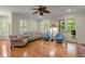Inviting living room with hardwood floors, comfortable seating, and access to outdoor space at 3756 Colonel Vanderhorst Circle, Mount Pleasant, SC 29466