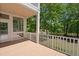 View of the porch with a screen door and railings looking to the yard with lake at 3756 Colonel Vanderhorst Circle, Mount Pleasant, SC 29466