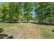 Picturesque backyard with lush greenery, mature trees, and a serene pond in a peaceful setting at 3756 Colonel Vanderhorst Circle, Mount Pleasant, SC 29466
