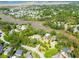 Beautiful aerial view of a neighborhood with lush landscaping near a river and marsh at 380 Tidal Reef Cir, Mount Pleasant, SC 29464